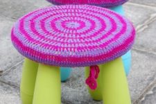 a bright neon IKEA Mammut stool with a colorful crochet coverup looks fun and bold