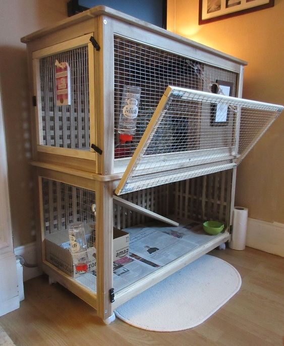 a bunny palace made of cages and IKEA Hol table is a cool hack for pet lovers