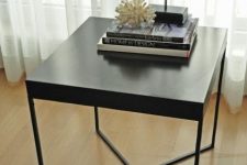a chic Lack table hack in black with a new metal base will easily fit any modern or Scandinavian space