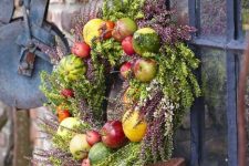 a cool fall wreath design with greenery