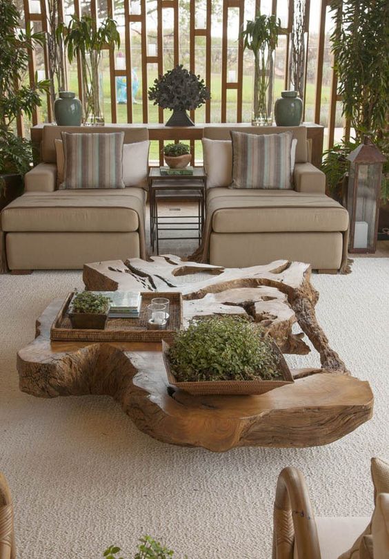 a coffee table made of stained driftwood is a beautiful statement for a modern interior and a gorgeous way to reuse some thrift materials