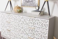 a creative Tarva dresser hack in dove grey, with white geometric inlays and tiny brass pulls