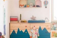 a double Tarva dresser with a mountain-inspired pattern and colorful knobs for an adventure-themed kid’s room