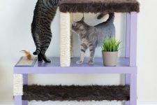 a stylish pastel cat condo made of IKEA Lack tables in lilac with scratchers and beds