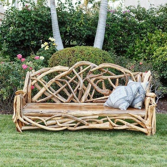 a unique garden bench made of driftwood, with printed pillows is an interesting solution and it lets reuse some simple driftwood