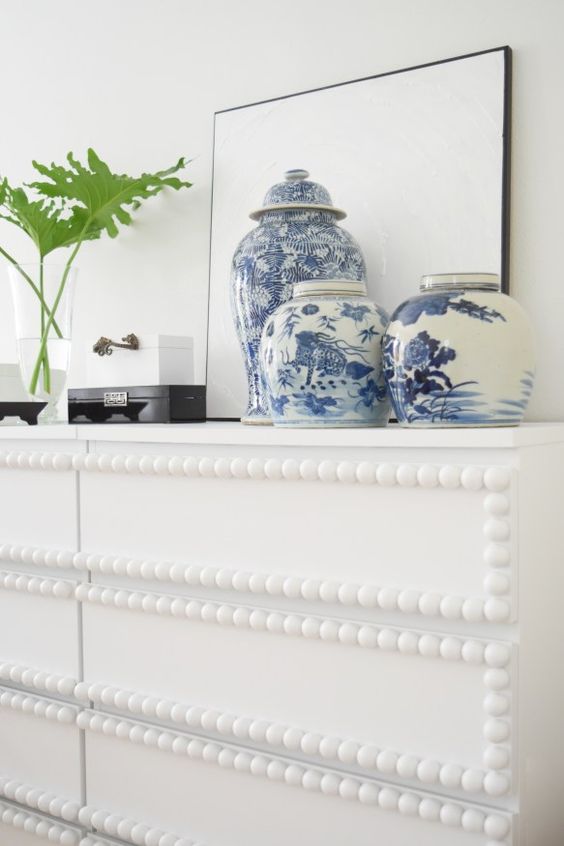 a whimsy IKEA Malm hack with bead trim is a unique idea that catches and eye in any space