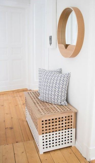 an IKEA Hol table hacked with white paint can be used as a bench in the entryway and feature some storage