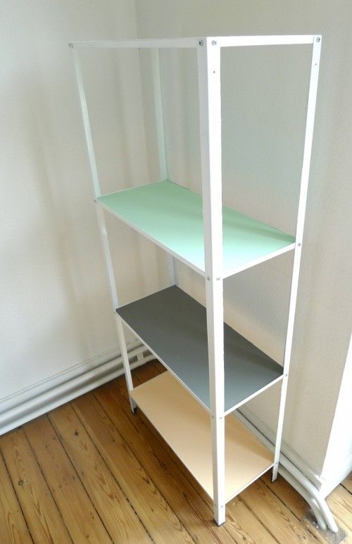 an IKEA Hyllis shelf hacked in tan, grey and mint is a very bold and fun idea