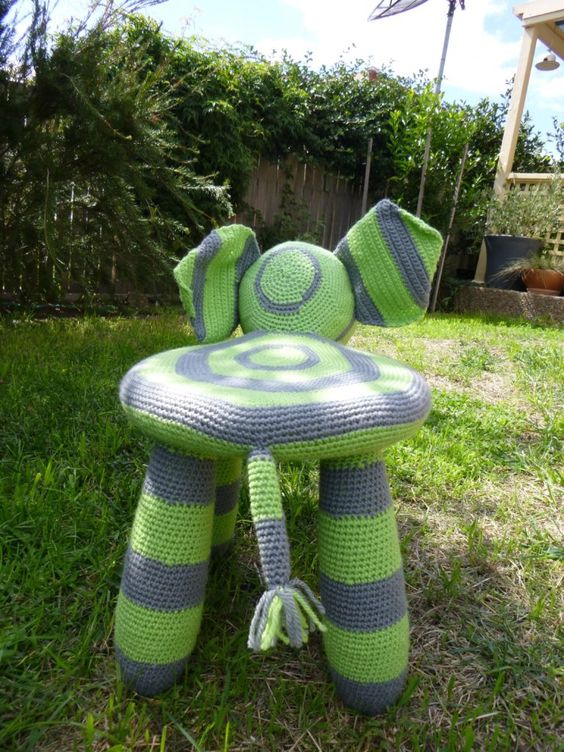 an IKEA Mammut stool totally transformed with a bright grey and green crochet cover that resembles an elephant