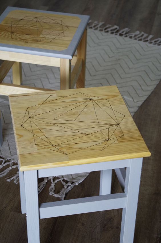 an IKEA Oddvar stool hacked with grey paint, with a geometric stained seat