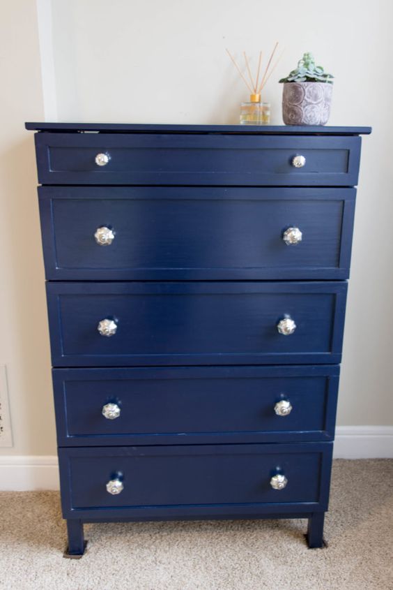 an elegant and simple Tarva makeover with trim, navy paint and beautiful silver knobs for a touch of vintage