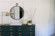 an elegant vintage Tarva hack in black, with vintage handles for a chic and stylish entryway