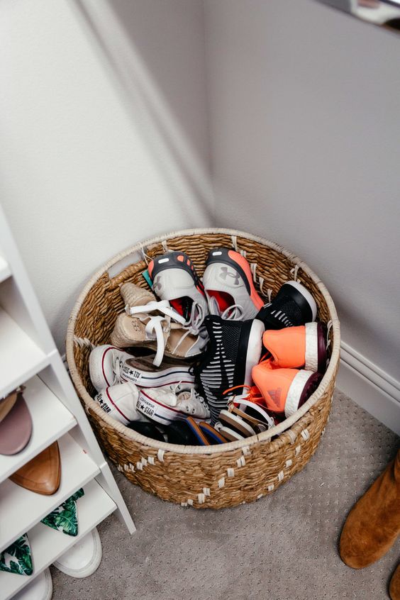 A basket for storing shoes is a simpel way to roganize   you can place it anywhere you want