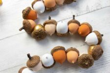a lovely fall garland made of acorns