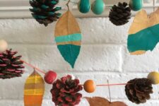 a colorful fall garland of bright beads, leaves and pinecones is a cool idea to decorate a colorful fall or Thanksgiving space