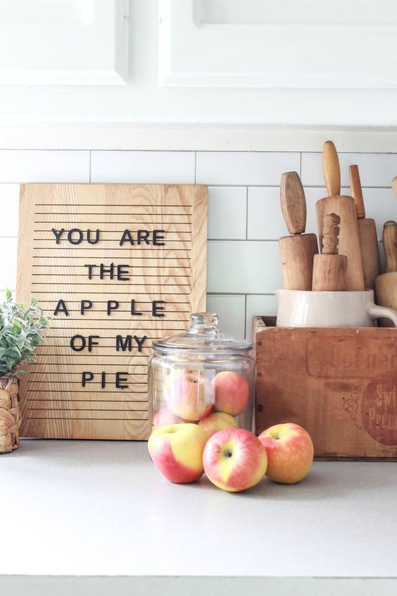 A contemporary fall sign of a light stained wooden piece and black letters for a fall kitchen