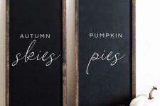 a duo of chalkboard signs with white letters is a stylish idea to spruce up your mantel for the fall