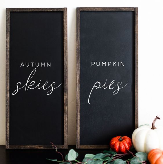 a duo of chalkboard signs with white letters is a stylish idea to spruce up your mantel for the fall