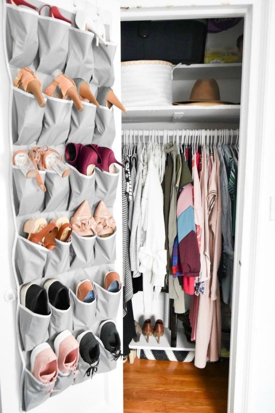 a fabric organizer on the closet door is great to store shoes or accessories, it's modern, simple and saves floor and shelf space