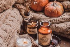 a fall arrangement of candles and baby’s breath in a bottle is a great idea for the fall