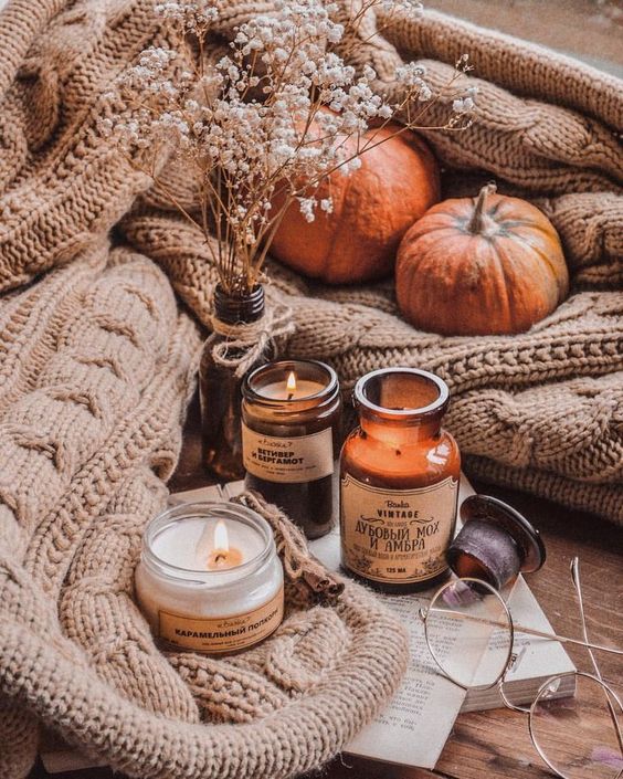 a fall arrangement of candles and baby's breath in a bottle is a great idea for the fall