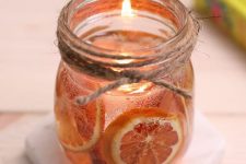 a jar with cinnamon, citrus, a floating candle is a gorgeous solution for a fall space, it will fill it with aromas