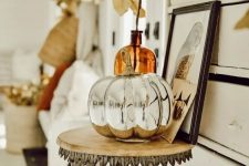 a mercury glass faux pumpkin is a stylish and shiny decoration you may create for the fall, it’s chic and vintage-inspired