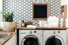 a lovely laundry with a scallop accent wall
