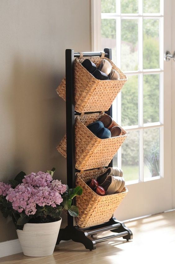 a shoe storage unit with several baskets is an elegant and cool unit for an entryway or closet