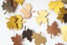 a simple colorful cardboard paper bunting is a timeless decor idea for fall and Thanksgiving