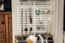 a smart organizer and storage unit attached to the closet door – wire baskets and a board for jewelry are a cool way to organize
