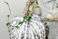 a styrofoam pumpkin covered with grey and white yarn, with a natural stem is a fantastic idea