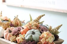 a wooden tray with dried blooms, leaves, muted color faux pumpkins is a beautiful and easy fall centerpiece
