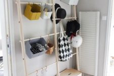 an open storage unit for accessories and shoes – some holders with hooks and boxes – closed and open supsended ones