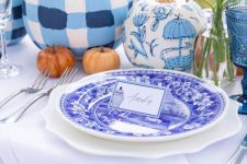 blue and white painted pumpkins to complete and a stylish blue and white fall tablescape with bright blooms