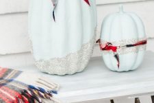cool light blue pumpkins with silver glitter and palid ribbons are fun, glam and rustic at the same time