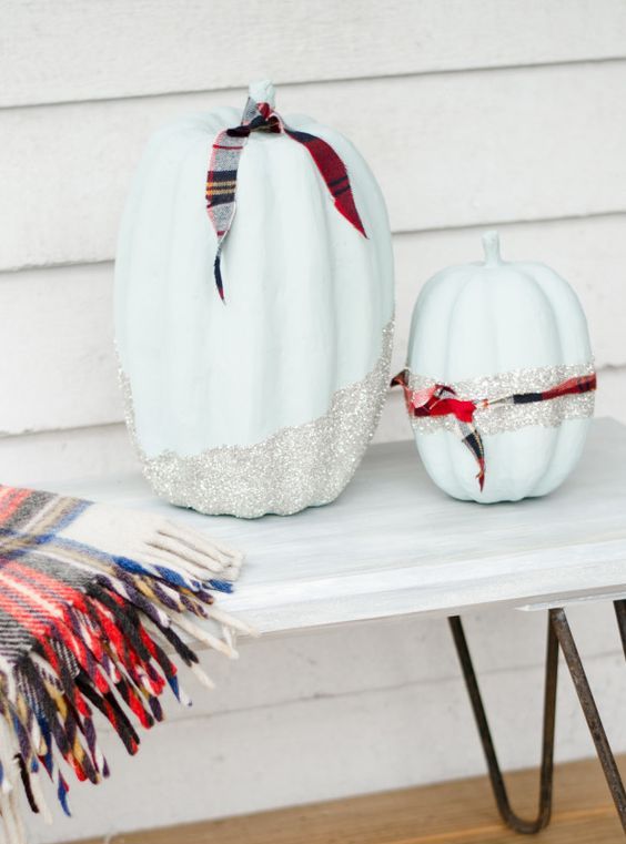 cool light blue pumpkins with silver glitter and palid ribbons are fun, glam and rustic at the same time