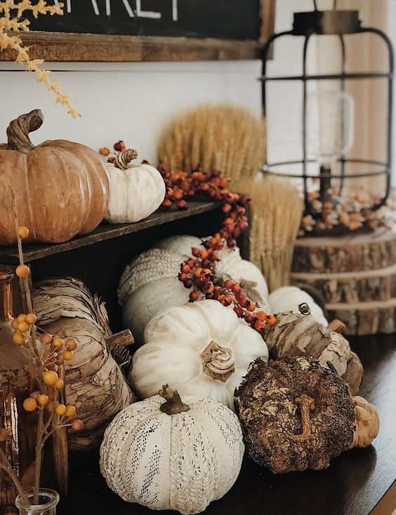 faux pumpkins, of fabric, plastic, bark and berries for a very naturalistic fall arrangement in your space