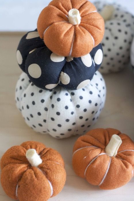 Faux pumpkins of fabric   usual orange and poka dot are a fun and cute idea for a long lasting decoration