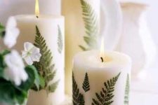 pillar candles with fern leaves attached add a woodland feel to your space and can be used not only in the fall but also in other seasons