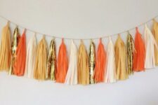 such a simple and bright tassel garland in fall colors is a lovely idea for fall and Thanksgiving, it looks chic