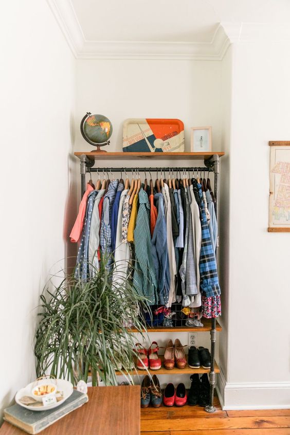 use an awkward nook to create an open clothes and shoe storage unit with shelves