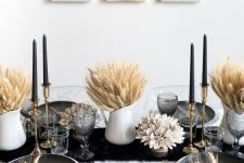 white jugs with wheat, gold candleholders with black candles and gold plates for a chic modern fall table setting