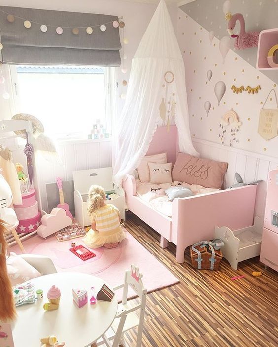 a cute grey and pink girl's bedroom with a pink Sundvik bed, grey shades, a lamp banner, pink decor and touches and whimsy wallpaper