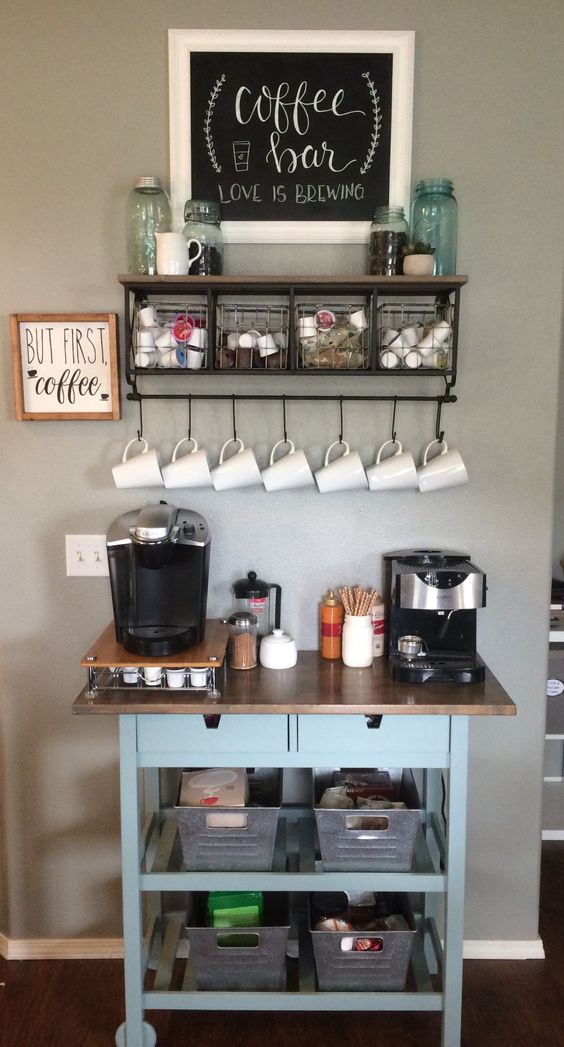 a home coffee bar with a blue IKEA Forhoja cart with a wooden countertop features a lot of open and closed storage