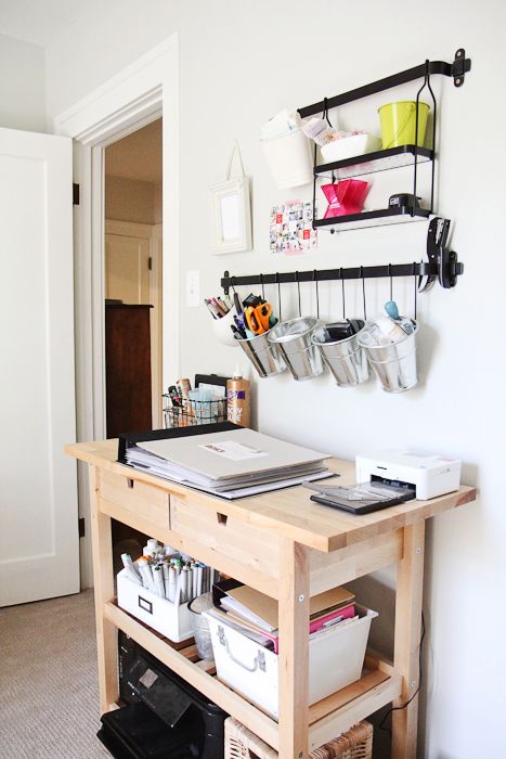 a home workspace or bill paying space done with an IKEA Forhoja cart, some shelves and railings