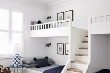 a modern farmhouse kids’ room with built-in bunk beds, navy and white bedding, layered rugs and side tables and baskets