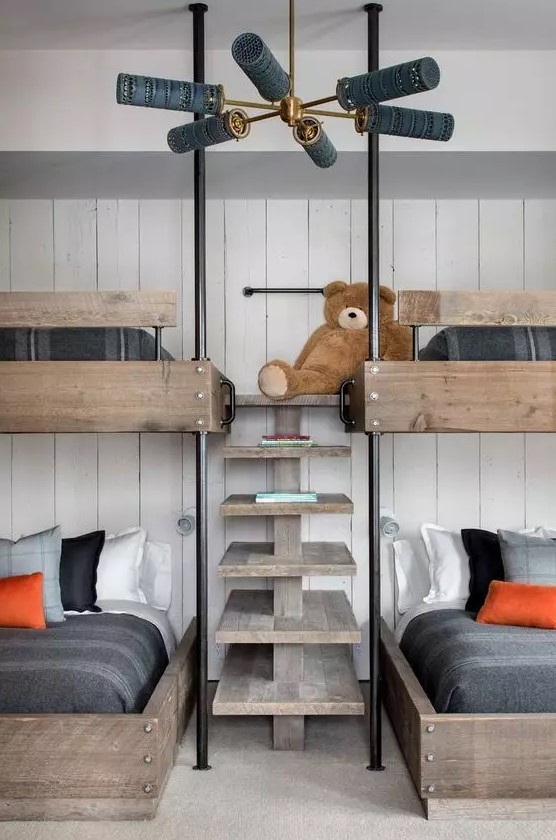 a modern rustic kids' room with a white shiplap wall, stained bunk beds with a wooden ladder and moody bedding is a stylish solution