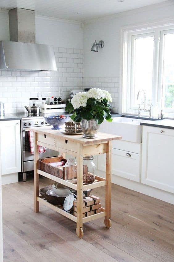 a small and chic kitchen island of an IKEA Forhoja cart with plenty of storage and a countertop