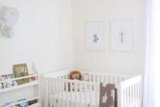 a soothing neutral nursery with an IKEA Sundvik crib, grey touches, faux fur and an open bookshelf